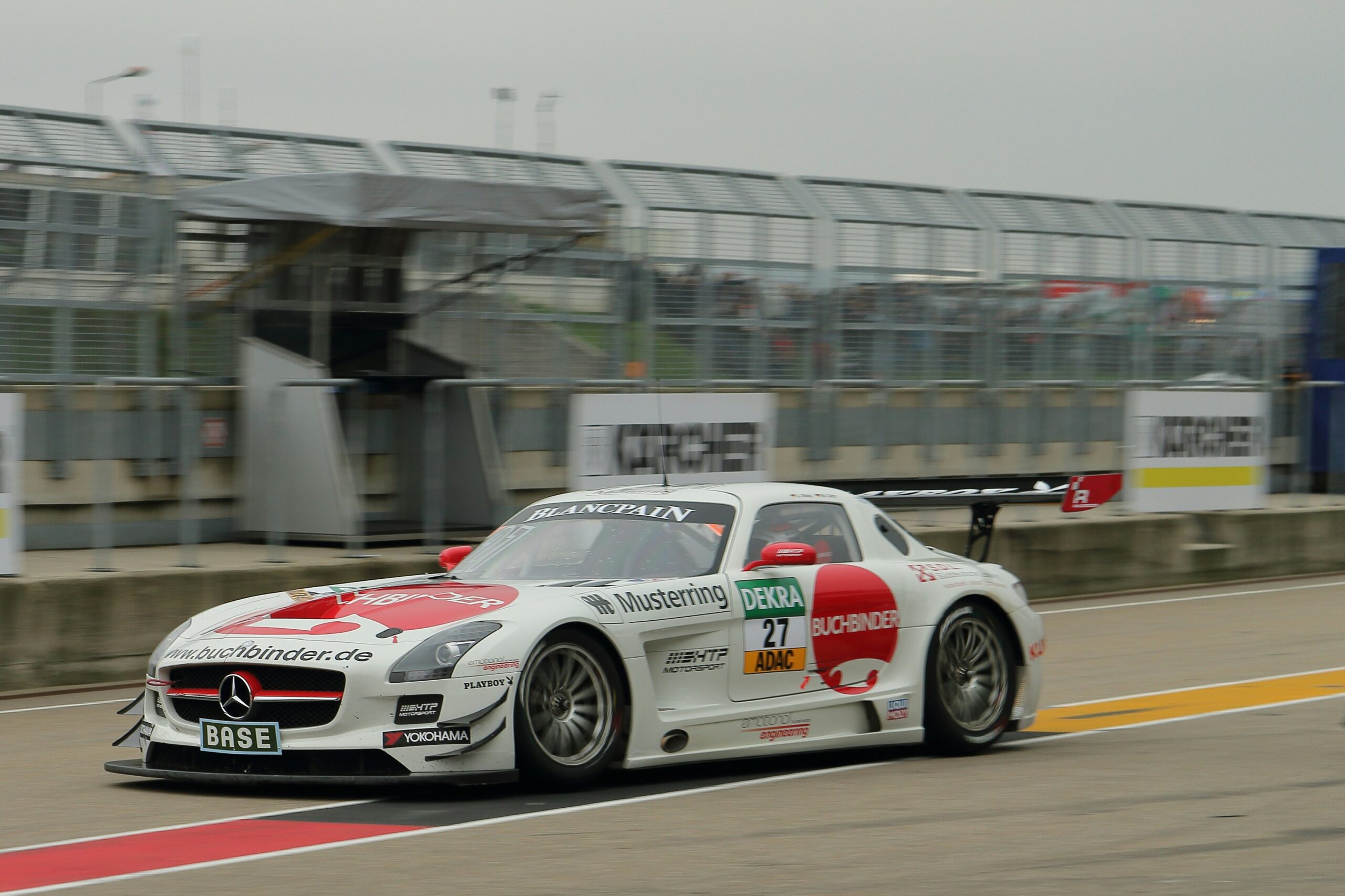 white and red Mercedes-Benz car on road